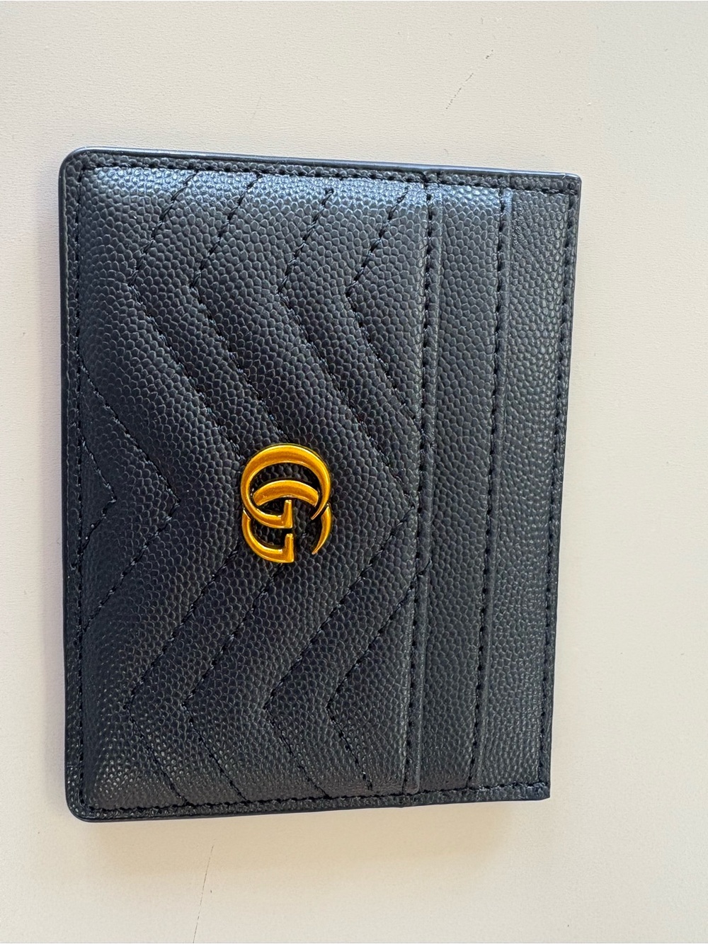 Source Unknown Black Quilted Card Holder with Gold Emblem